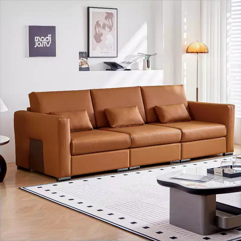 Canapé en cuir orange avec accoudoirs larges