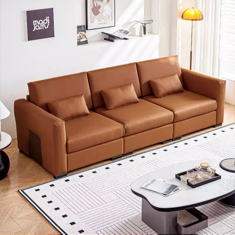 Canapé en cuir orange avec accoudoirs larges