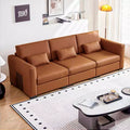 Canapé en cuir orange avec accoudoirs larges