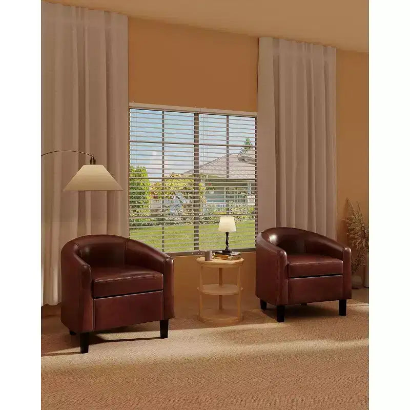 Fauteuil de salon en similicuir, avec coussin moelleux.